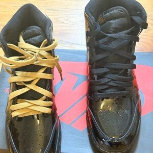 Jordan High-Top Sneakers in Black and Gold